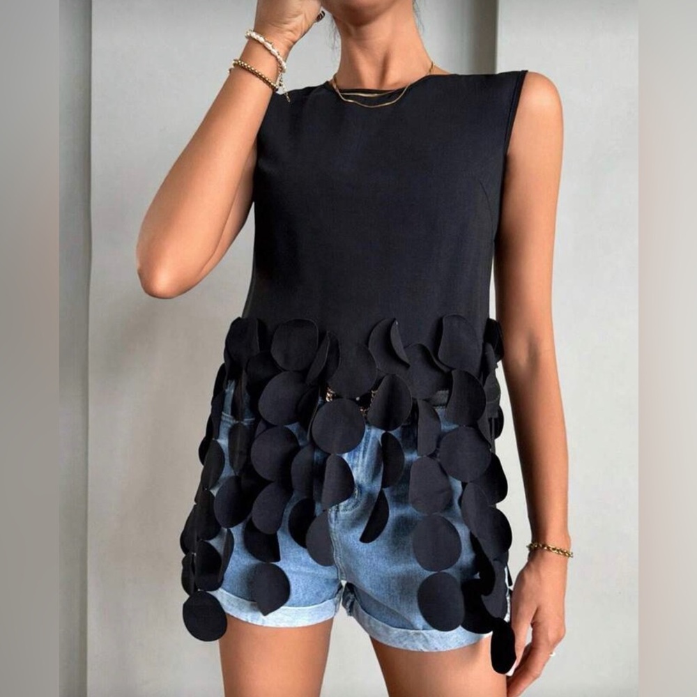Elegant Black Sleeveless Top with Circle Accents